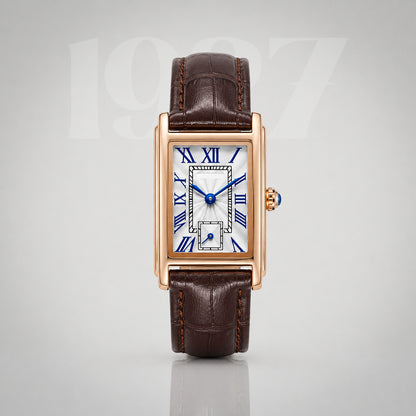 1927 gold Art Deco tank watch, silver guilloche dial with blue Roman numerals on brown crocodile strap