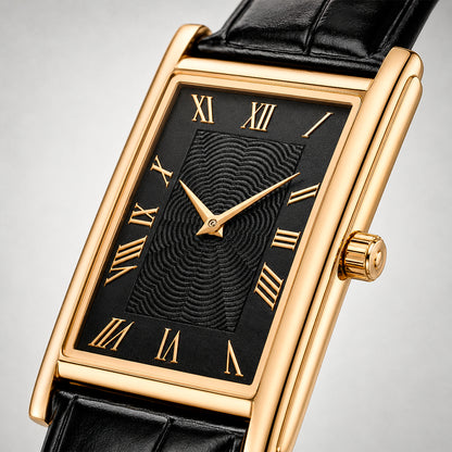 Close-up of the 1962 gold tank watch, black guilloche dial and gold Roman numerals